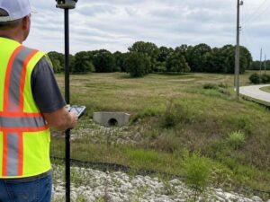 Land surveyor conducting a due diligence survey on a commercial property in Pembroke Pines, FL before site planning and development.